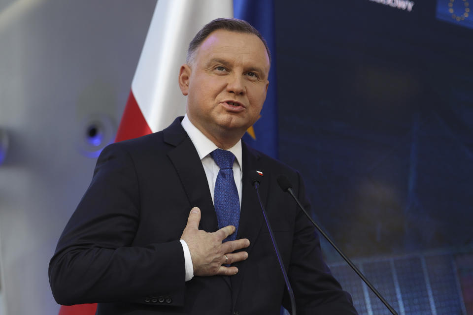 Polish President Andrzej Duda speaks at a joint news conference with European Commission President Ursula von der Leyen and Poland's Prime Minister Mateusz Morawiecki at the headquarters of Poland's Power Grid in Konstancin-Jeziorna, Poland, Thursday, June 2, 2022. The independence of Poland's courts is at the heart of a dispute with the European Union, which has withheld billions of euros in pandemic recovery funds. (AP Photo/Michal Dyjuk)