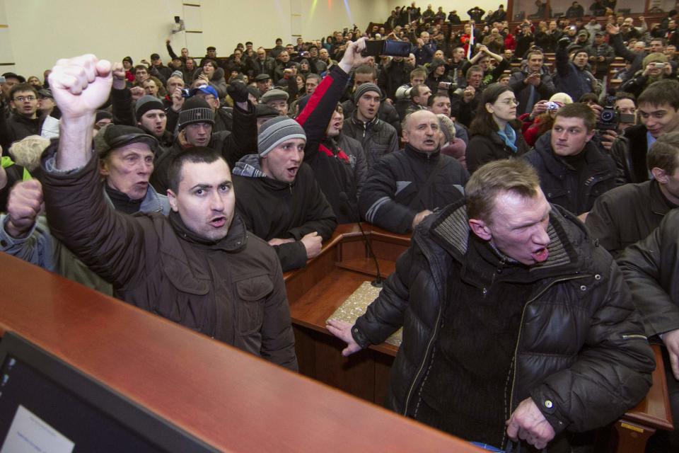 Pro-Russian demonstrators hold a meeting after entering the regional government building in Donetsk