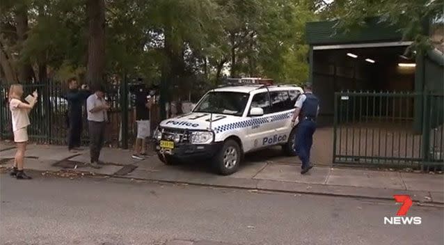 Lambkin hid in the police car on arrival to court. Source: 7 News