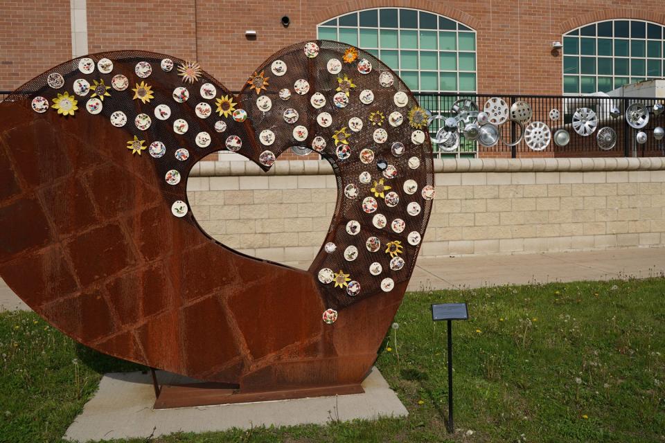 This sculpture called, “Love of Community,” was created by artist Jim Bundshuh in 2020.
