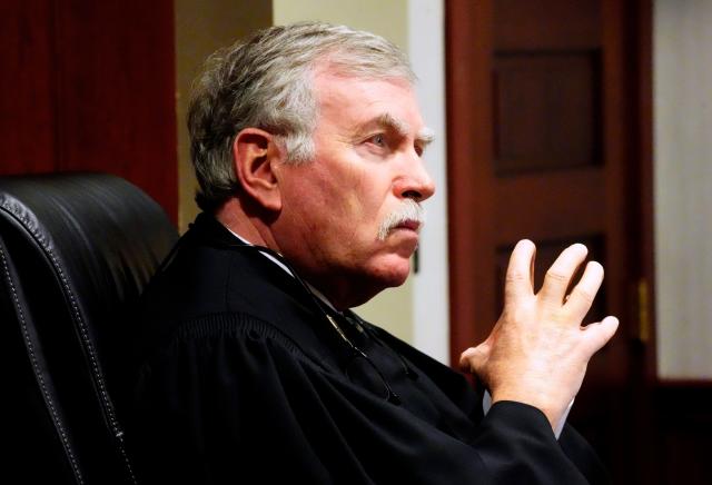 Visiting Judge Daniel Hogan listens to Roger Reynolds, former Butler County auditor, speak. Hogan sentenced Reynolds to five years community control, $5,000 fine and 30 days in jail that will have to be completed over the five years. He also has to pay court costs.