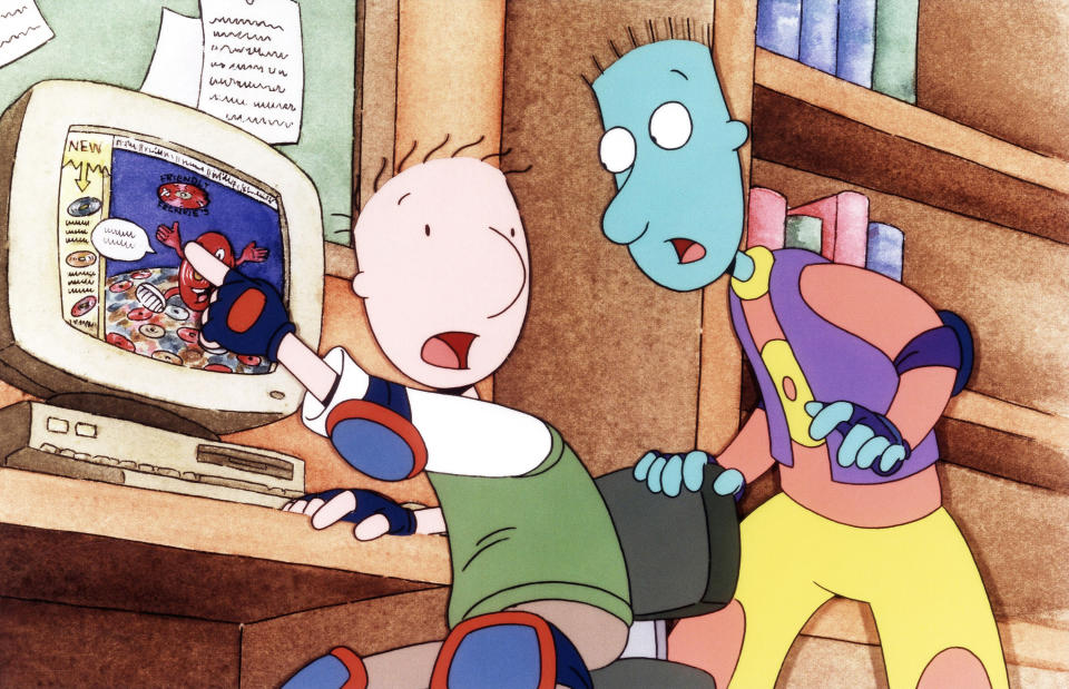 Doug and Skeeter point at a computer monitor