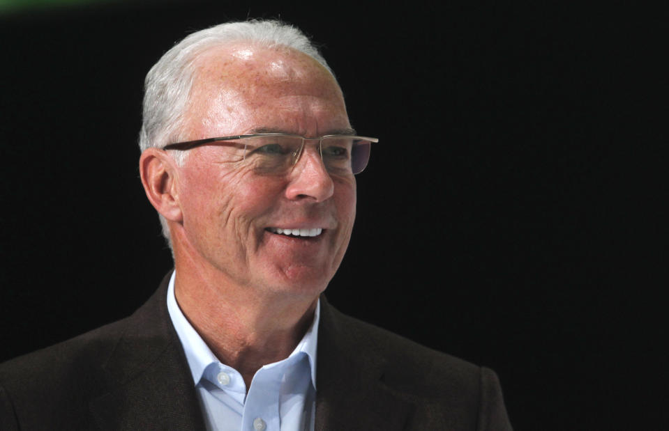 FILE - Fifa executive committee member Franz Beckenbauer smiles during the FIFA Soccer World Cup award ceremony at the adidas headquarters in Herzogenaurach near Nuremberg, southern Germany, on Tuesday, Dec. 14, 2010. (AP Photo/Matthias Schrader, File)