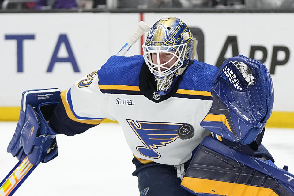 St. Louis Blues goaltender Jordan Binnington stops a shot during the second period of an NHL hockey game against the Los Angeles Kings Saturday, March 4, 2023, in Los Angeles. (AP Photo/Mark J. Terrill)