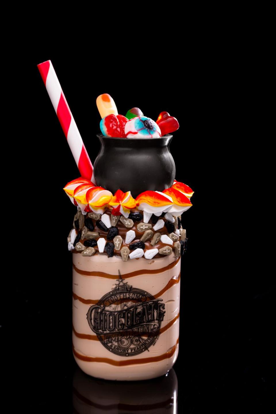At Universal CityWalk, guests can indulge in the new Black Magic Milkshake (gluten-free) at The Toothsome Chocolate Emporium & Savory Feast Kitchen, featuring pumpkin dulce de leche ice cream with a hazelnut-and-tombstone-sprinkled rim – topped with a cauldron filled with gummy “severed body parts” over whipped flames.