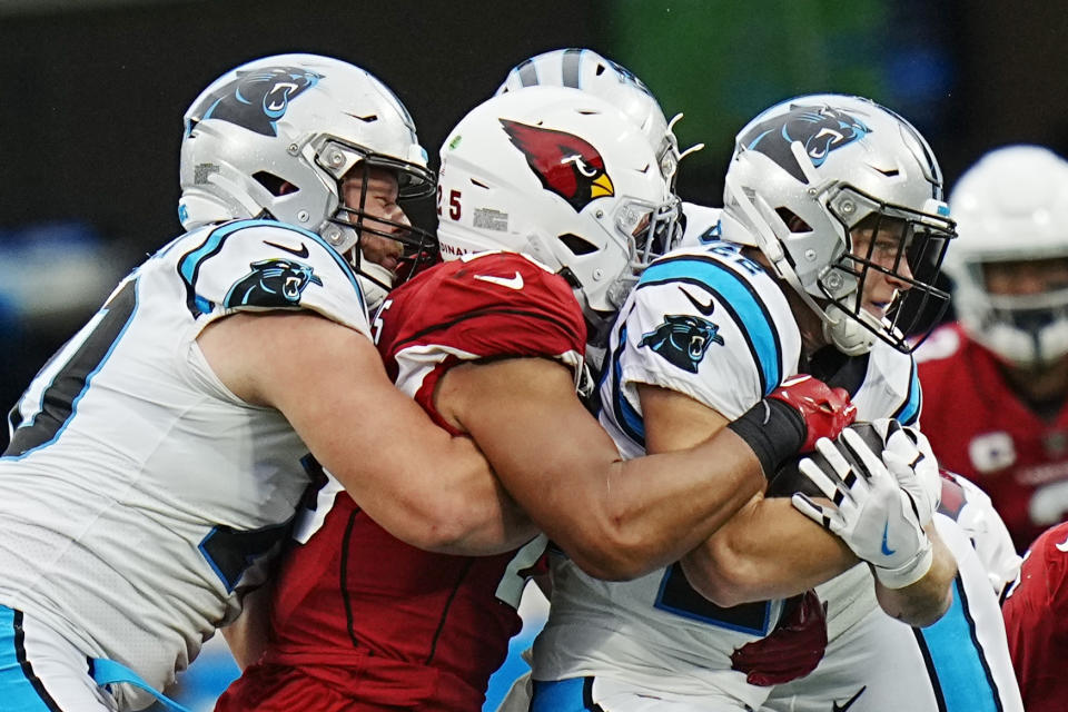 Carolina Panthers running back Christian McCaffrey is tackled by Arizona Cardinals linebacker Zaven Collins during the first half of an NFL football game on Sunday, Oct. 2, 2022, in Charlotte, N.C. (AP Photo/Rusty Jones)