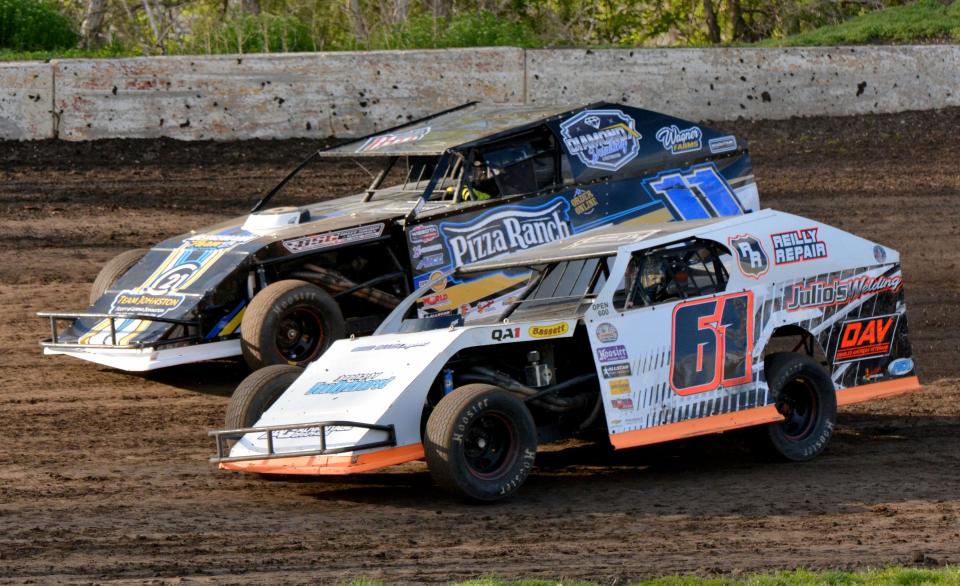 Zach LaQua of Watertown (61) and Kyle Schell of Aberdeen compete in a Midwest modified heat race during a 2022 racing program at Casino Speedway.