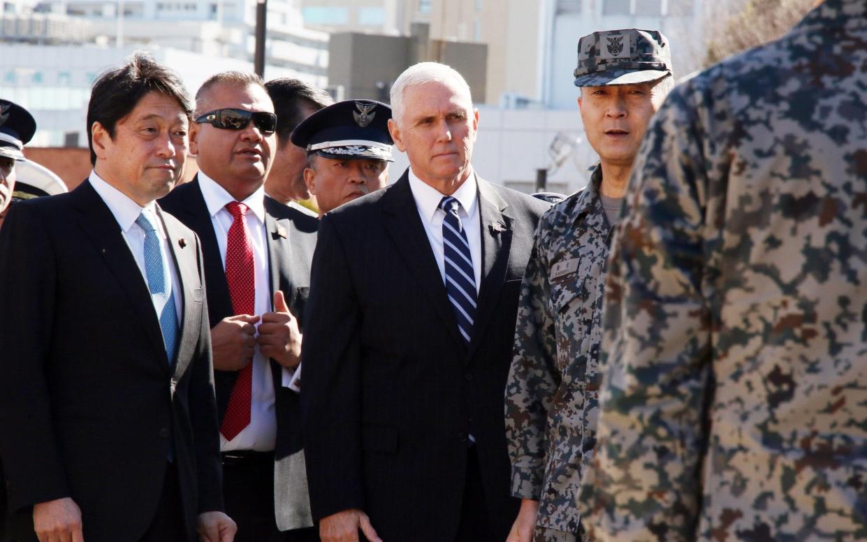 U.S. Vice President Mike Pence (C) listens to a Japanese Self-Defense Force official (R) as he inspects Patriot Advanced Capability (PAC-3) missile interceptor launcher at the Defense Ministry in Tokyo on Wednesday - Barcroft Media