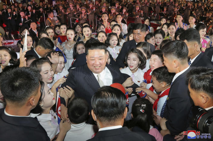 This photo provided by the North Korean government shows North Korean leader Kim Jong Un, center, is surrounded by performers during a celebration marking the nation's 74th anniversary in Pyongyang, North Korea, on Sept. 8, 2022. Independent journalists were not given access to cover the event depicted in this image distributed by the North Korean government. The content of this image is as provided and cannot be independently verified. Korean language watermark on image as provided by source reads: "KCNA" which is the abbreviation for Korean Central News Agency. (Korean Central News Agency/Korea News Service via AP)