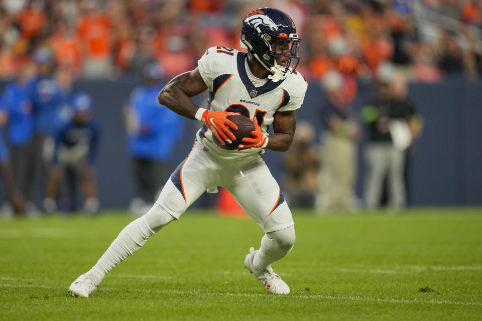 Denver Broncos cornerback Essang Bassey intercepts a pass against the Los Angeles Rams during the first half of an NFL preseason football game Saturday, Aug. 26, 2023, in Denver. (AP Photo/Jack Dempsey)