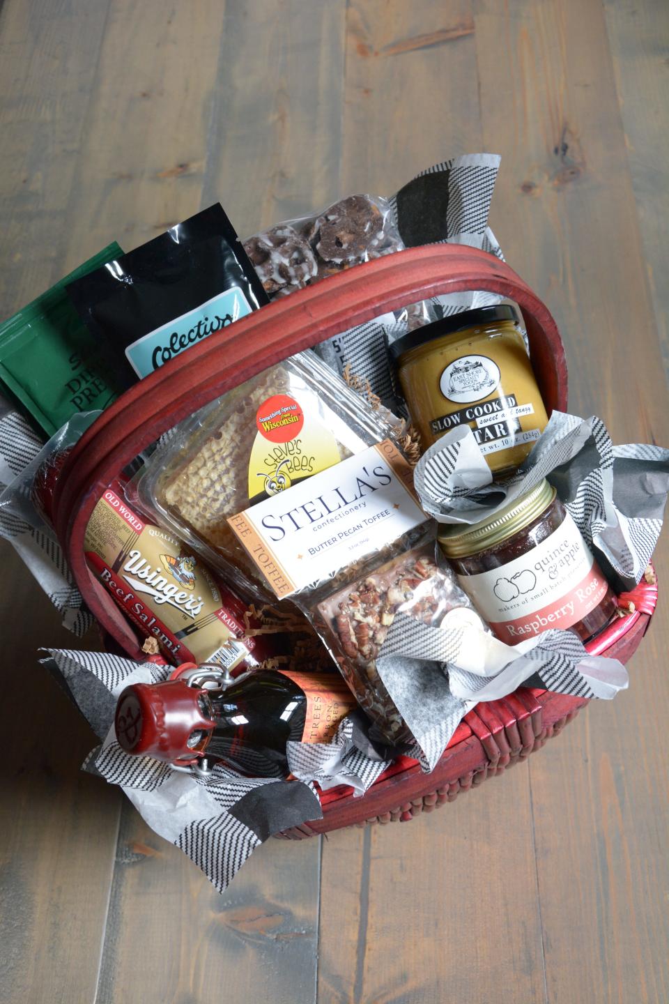 A customized gift basket from Larry’s Market in Brown Deer features coffee from Colectivo (Milwaukee), honeycomb from Steve’s Bees (Mequon), mustard and pretzels from East Shore Specialty Foods (Hartland), Usinger’s salami (Milwaukee), B&E’s Trees bourbon barrel aged maple syrup (Viroqua), raspberry rose preserves from Quince & Apple (Madison), toffee from Stella’s Confectionery (Milwaukee) and chocolate covered pretzels from Larry’s Market.