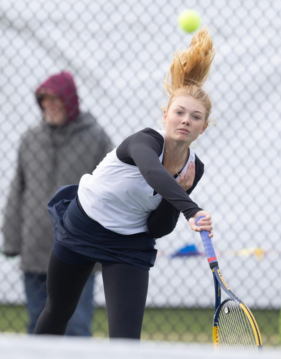 Archbishop Hoban's Haley Slay returns a shot from Eaton's Mallory Hitchcock during Day 1 of the OHSAA state tennis tournament Oct. 19, 2023, in Wooster.