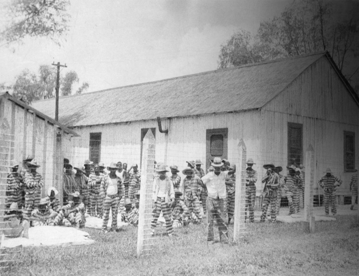 Bluesman Huddie Ledbetter, known as Leadbelly, standing in the foreground at prison compound No 1. in the Louisiana State Penitentiary. Alan Lomax first recorded Leadbelly as part of the New Deal's Federal Music Project. (Photo by Alan Lomax/Library of Congress/Corbis/VCG via Getty Images) (Photo: Library of Congress via Getty Images)