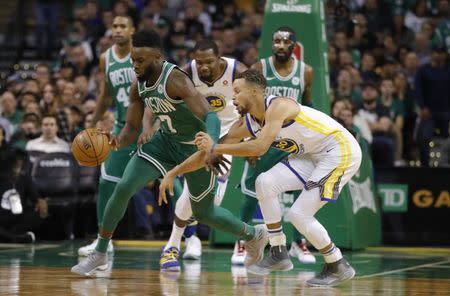 Nov 16, 2017; Boston, MA, USA; Boston Celtics guard Jaylen Brown (7) steals the ball from Golden State Warriors guard Stephen Curry (30) in the second half at TD Garden. Mandatory Credit: David Butler II-USA TODAY Sports