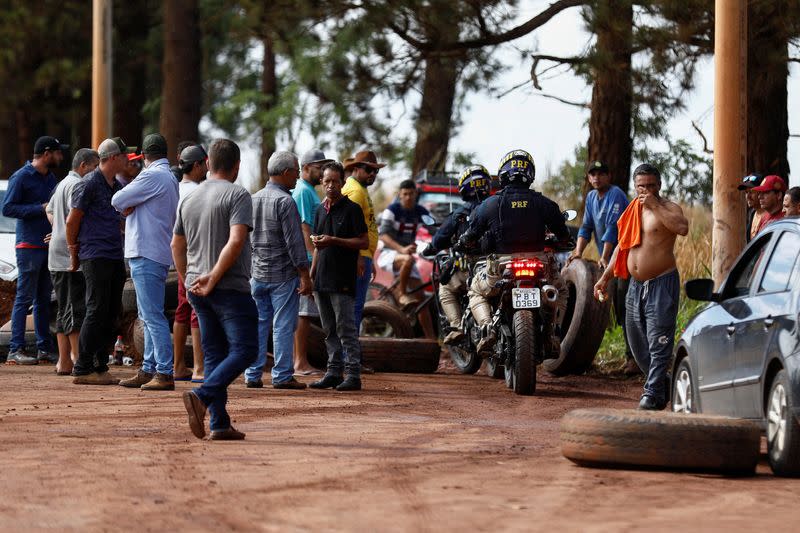 Supporters of Brazil's President Jair Bolsonaro block highway BR-251 during a protest against President-elect Luiz Inacio Lula da Silva in Planaltina