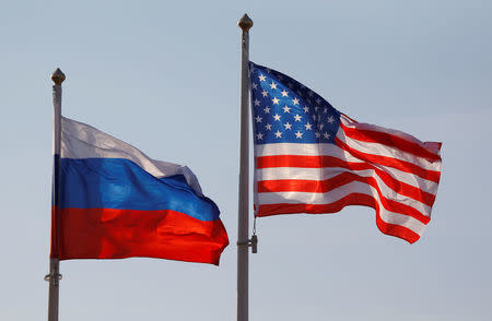 FILE PHOTO: National flags of Russia and the U.S. fly at Vnukovo International Airport in Moscow, Russia April 11, 2017. REUTERS/Maxim Shemetov/File Photo