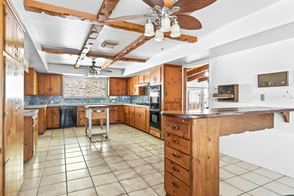 The kitchen includes original built-ins. - Credit: Zach Brown for Douglas Elliman Realty