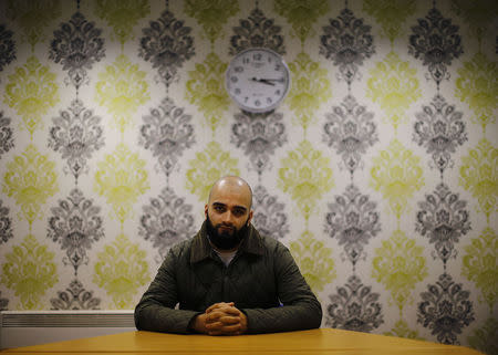 Abdul Waheed poses for a photograph in Birmingham, central England November 20, 2014. REUTERS/Darren Staples