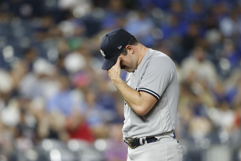 New York Yankees pitcher Carlos Rodon waits to be removed during the first inning of the team's baseball game against the Kansas City Royals in Kansas City, Mo., Friday, Sept. 29, 2023. (AP Photo/Colin E. Braley)