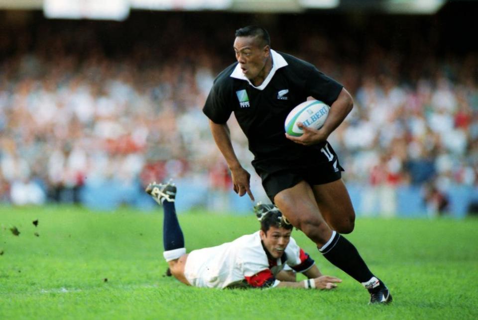 Jonah Lomu powers past the despairing Tony Underwood to score a try in Cape Town.