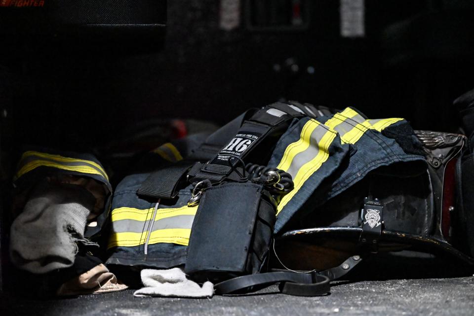 A Southwest Central firefighter's gear is arranged outside their truck in the bay.