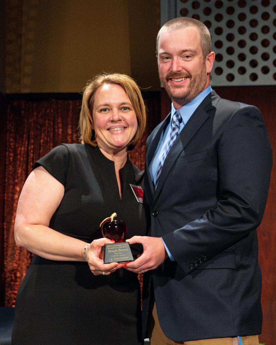 Shayla Brown, a counselor at Blanchet Catholic School, is awarded a Crystal Apple during the 25th annual Crystal Apple Awards at the Salem Convention Center on Wednesday in Salem.