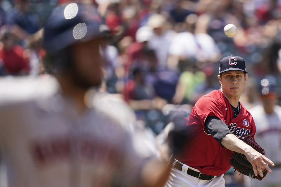 Cleveland Indians relief pitcher Phil Maton throws out Houston Astros' Abraham Toro at first base in the sixth inning of a baseball game, Sunday, July 4, 2021, in Cleveland. (AP Photo/Tony Dejak)