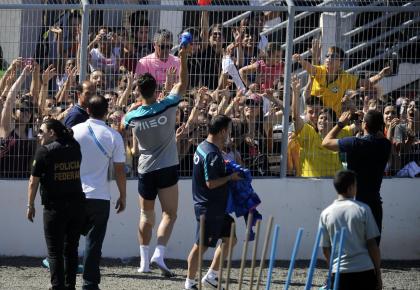 Cristiano Ronaldo throws a shirt to fans after a training session. (AP)