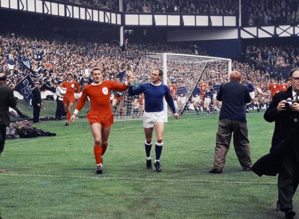 Roger Hunt and Ray Wilson parade the World Cup around Goodison Park before the 1966 Charity Shield.