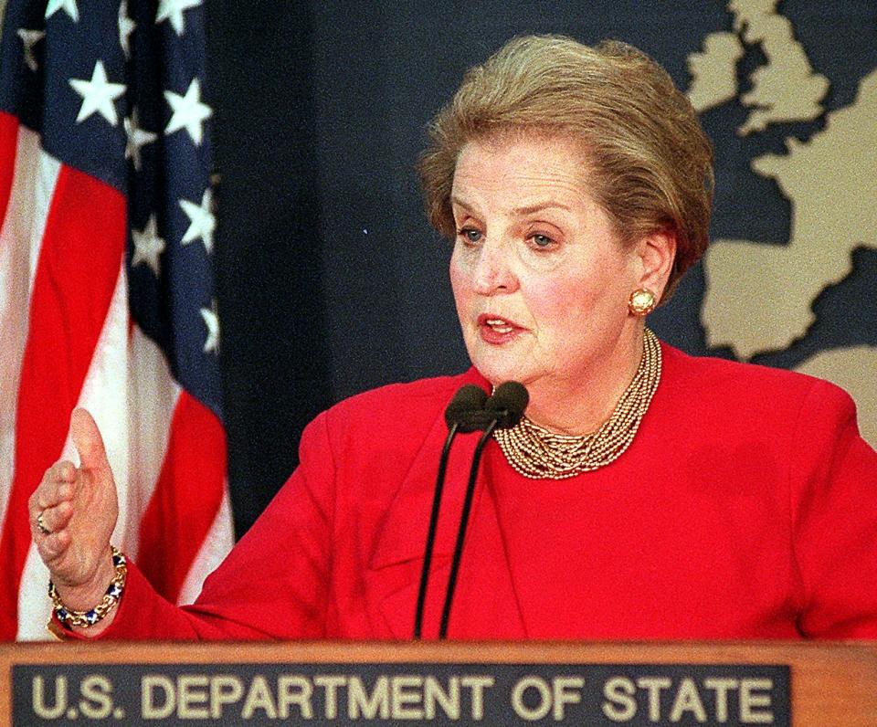 Madeleine Albright behind a lectern reading: U.S. Department of State.