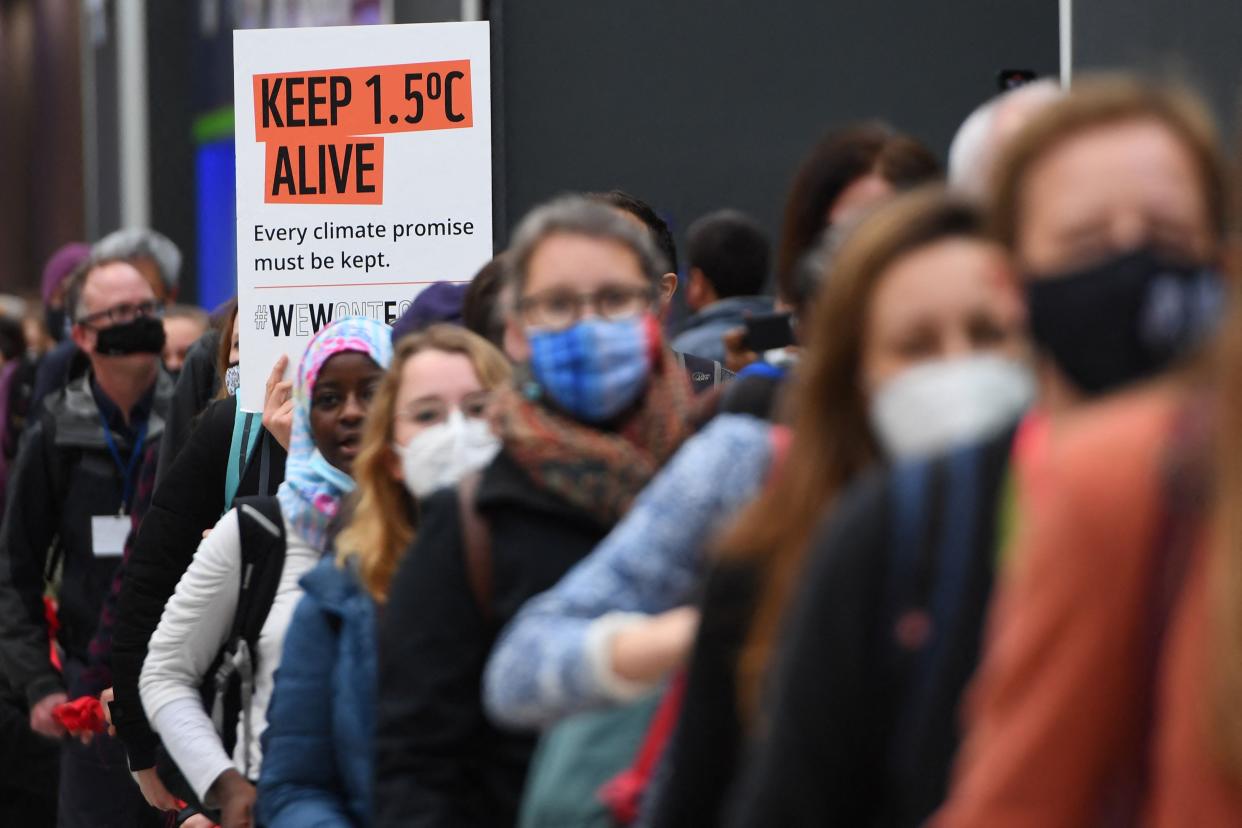 Climate activists protest in Glasgow during the COP26 climate summit on November 12, 2021.  (Photo by ANDY BUCHANAN / AFP)