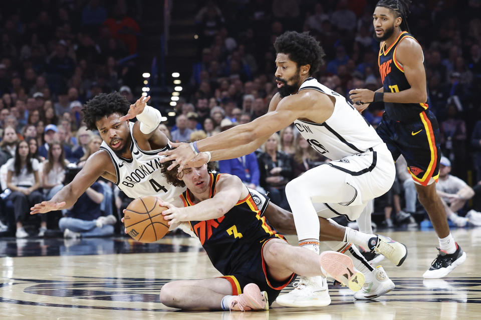 Dec 31, 2023; Oklahoma City, Oklahoma, USA; Oklahoma City Thunder guard Josh Giddey (3) fights for the ball with Brooklyn Nets guards Spencer Dinwiddie (26) and <a class="link " href="https://sports.yahoo.com/nba/players/5822" data-i13n="sec:content-canvas;subsec:anchor_text;elm:context_link" data-ylk="slk:Dennis Smith Jr;sec:content-canvas;subsec:anchor_text;elm:context_link;itc:0">Dennis Smith Jr</a>. (4) during the second quarter at Paycom Center. Mandatory Credit: Alonzo Adams-USA TODAY Sports