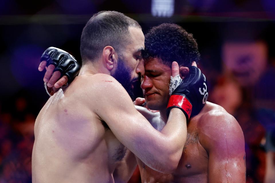 Belal Muhammad (left) consoles Gilbert Burns after outpointing the injured Brazilian (Getty Images)