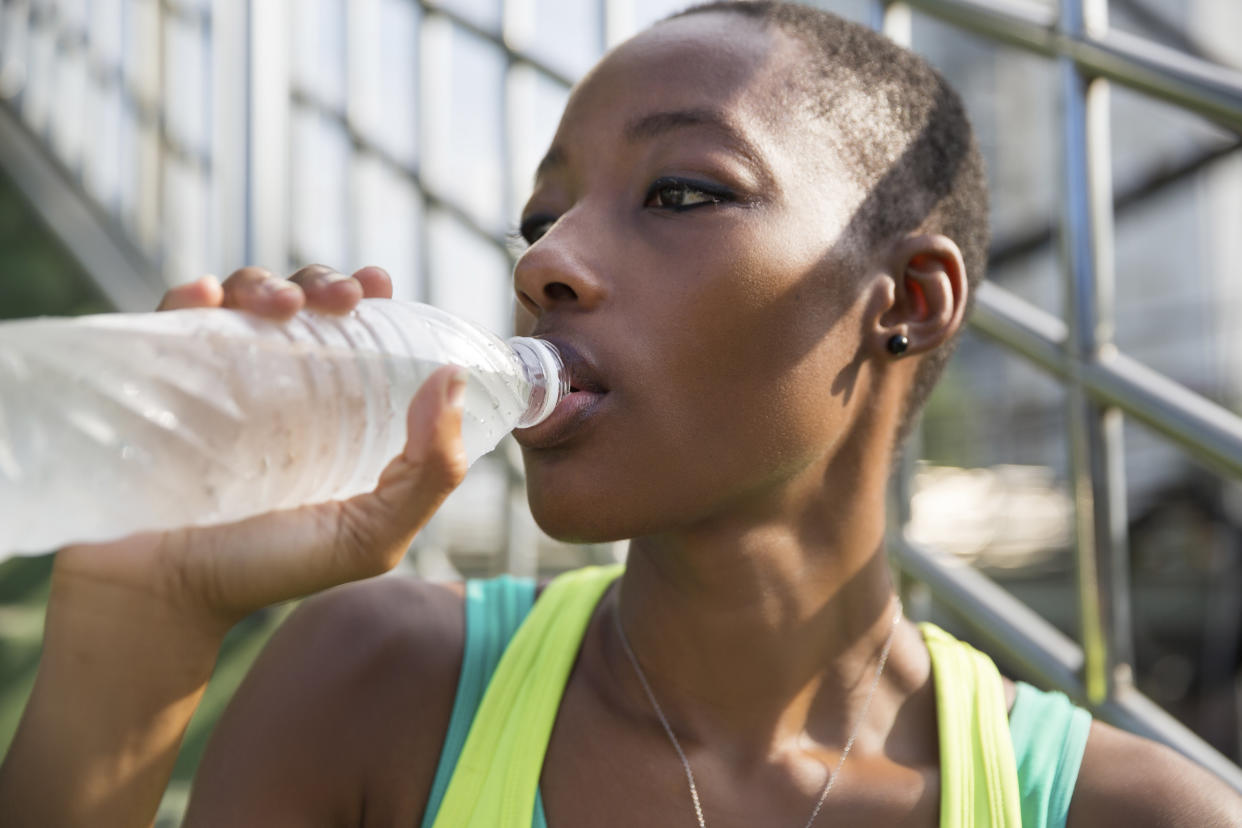 Plastic water bottles contain particles that may be dangerous to your health. Here's what to know.
