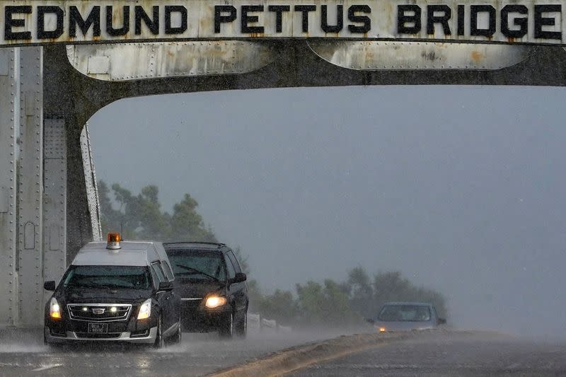 A hearse carrying the body of the late U.S. Congressman John Lewis crosses the Edmund Pettus Bridge in Selma