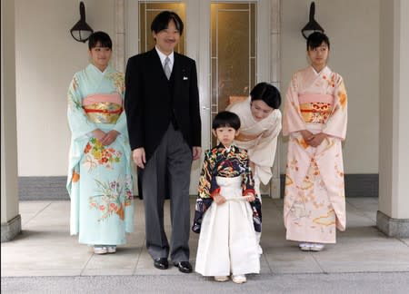 FILE PHOTO: Japan's Prince Hisahito, son of Prince Akishino and Princess Kiko, is accompanied by his parents after the Chakko-no-Gi and Fukasogi-no-gi ceremonies in Tokyo