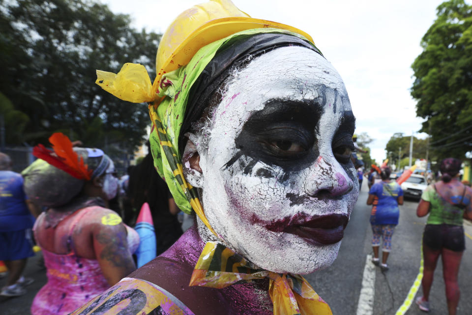 PORT OF SPAIN, TRINIDAD - FEBRUARY 27: J'ouvert reveller looks on during a parade with the Rapso music band 3canal for the 20th anniversary celebration of their song Blue as part of Trinidad Carnival at Queen's Park Savannah on February 27, 2017 in Port of Spain, Trinidad. (Photo by Sean Drakes/LatinContent via Getty Images)