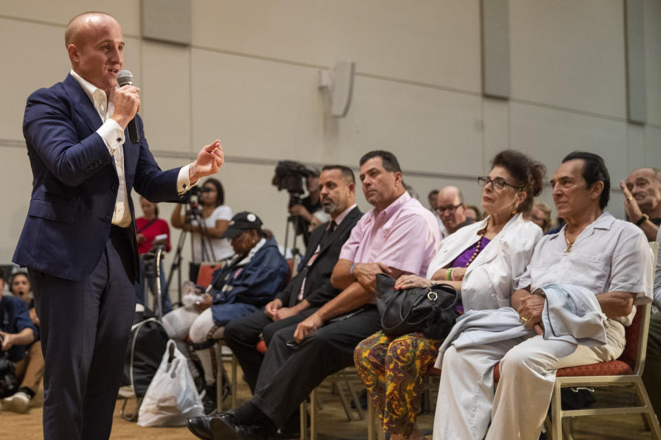 U.S. Rep. Max Rose, left, speaks to constituents during a town hall meeting, Wednesday, Oct. 2, 2019, at the Joan and Alan Bernikow Jewish Community Center in the Staten Island borough of New York. (AP Photo/Mary Altaffer)