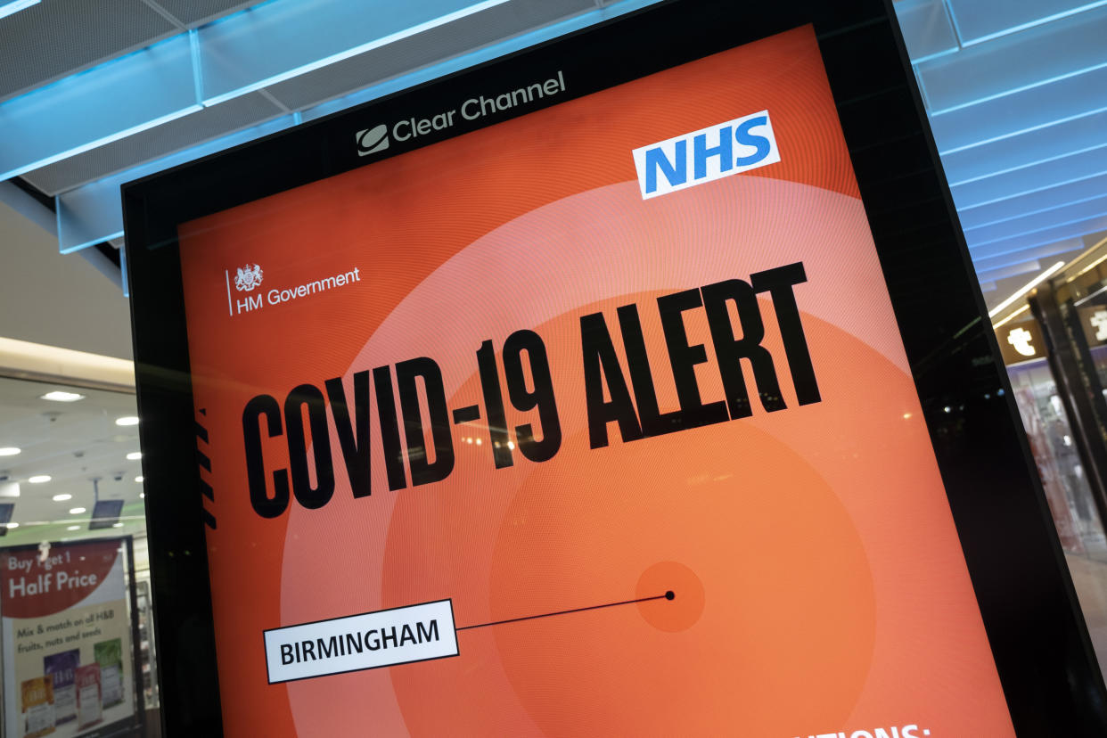 New Covid-19 Alert Public Health England, NHS information board in Grand Central shopping centre on the long awaited 'freedom day' when all remaining coronavirus restrictions are lifted in the UK on 19th July 2021 in Birmingham, United Kingdom. While many people are wearing face masks, they are no longer mandatory, while government advice suggests that it is advised to wear a face covering in busy public places inside and on transport. (photo by Mike Kemp/In Pictures via Getty Images)