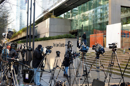 Members of the news media stand outside the B.C. Supreme Court bail hearing of Huawei CFO Meng Wanzhou, who was held on an extradition warrant in Vancouver, British Columbia, Canada December 7, 2018. REUTERS/David Ryder