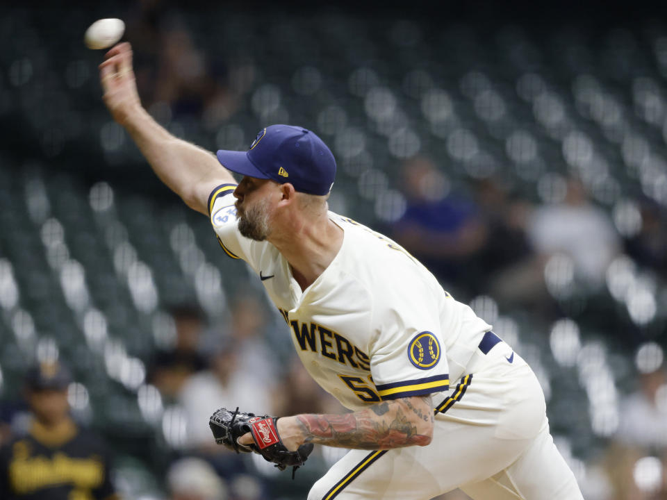 Milwaukee Brewers' John Axford pitches against the Pittsburgh Pirates during the ninth inning of a baseball game Monday, Aug. 2, 2021, in Milwaukee. (AP Photo/Jeffrey Phelps)