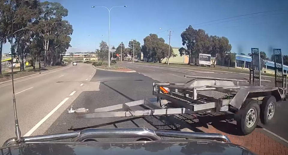 A dashcam video has captured the moment a trailer came skidding across a busy road. Source: Dash Cam Owners Australia