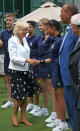 <p>Dressed in a polka dot dress and a tailored jacket, Camilla greeted the ball boys and girls ahead of a Wimbledon match. <i>[Photo: PA Images]</i></p>