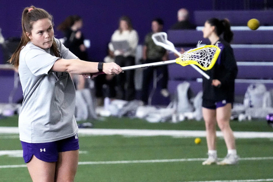 Northwestern's Erin Coykendall warms up during lacrosse practice in Evanston, Ill., Tuesday, Feb. 6, 2024. (AP Photo/Nam Y. Huh)