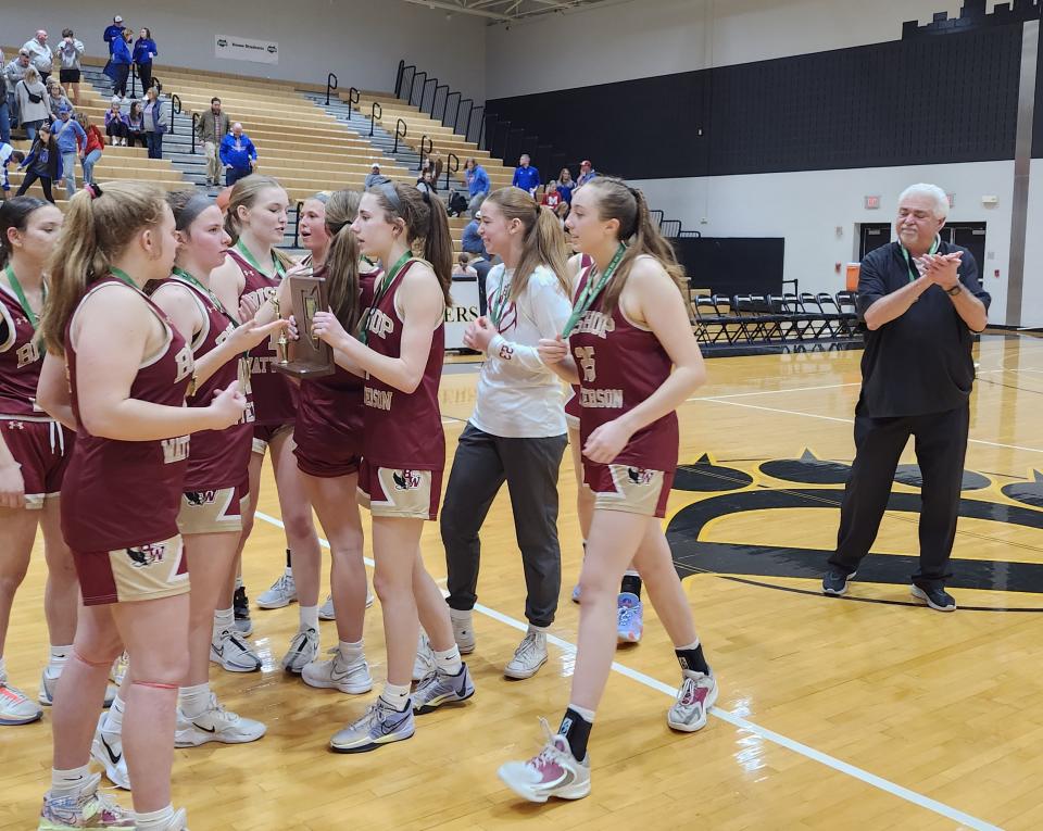 Watterson celebrates its first Division I district championship since 2004 as coach Sam Davis watches from afar Saturday at Ohio Dominican. Watterson, the No. 8 seed, knocked off third-seeded Marysville 56-49 in overtime.