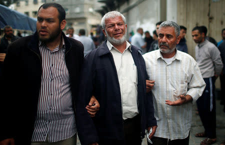 Relatives of a Palestinian electrical engineer Fadi al-Batash, who was shot to death in Malaysia, mourn outside his family house in the northern Gaza Strip April 21, 2018. REUTERS/Mohammed Salem