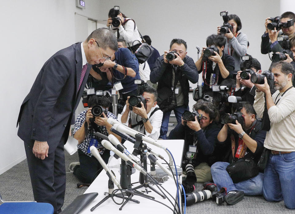 Nissan Motor Co. President and Chief Executive Officer Hiroto Saikawa bows as he leaves the venue after a press conference at Nissan Motor Co. Global Headquarter Monday Nov. 19, 2018 in Yokohama, near Tokyo. Nissan Motor Co.'s high-flying chairman Carlos Ghosn was arrested Monday and will be dismissed after he allegedly under-reported his income and engaged in other misconduct, the company said Monday. (Kyodo News via AP)