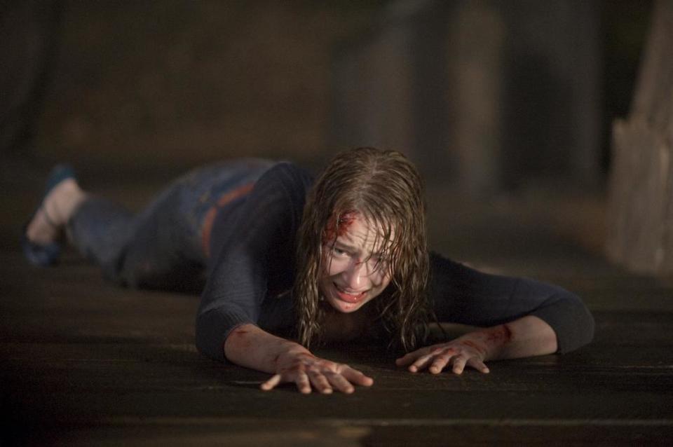In this film image released by Lionsgate, Kristen Connolly is shown in a scene from "The Cabin in the Woods." (AP Photo/Lionsgate, Diyah Pera)