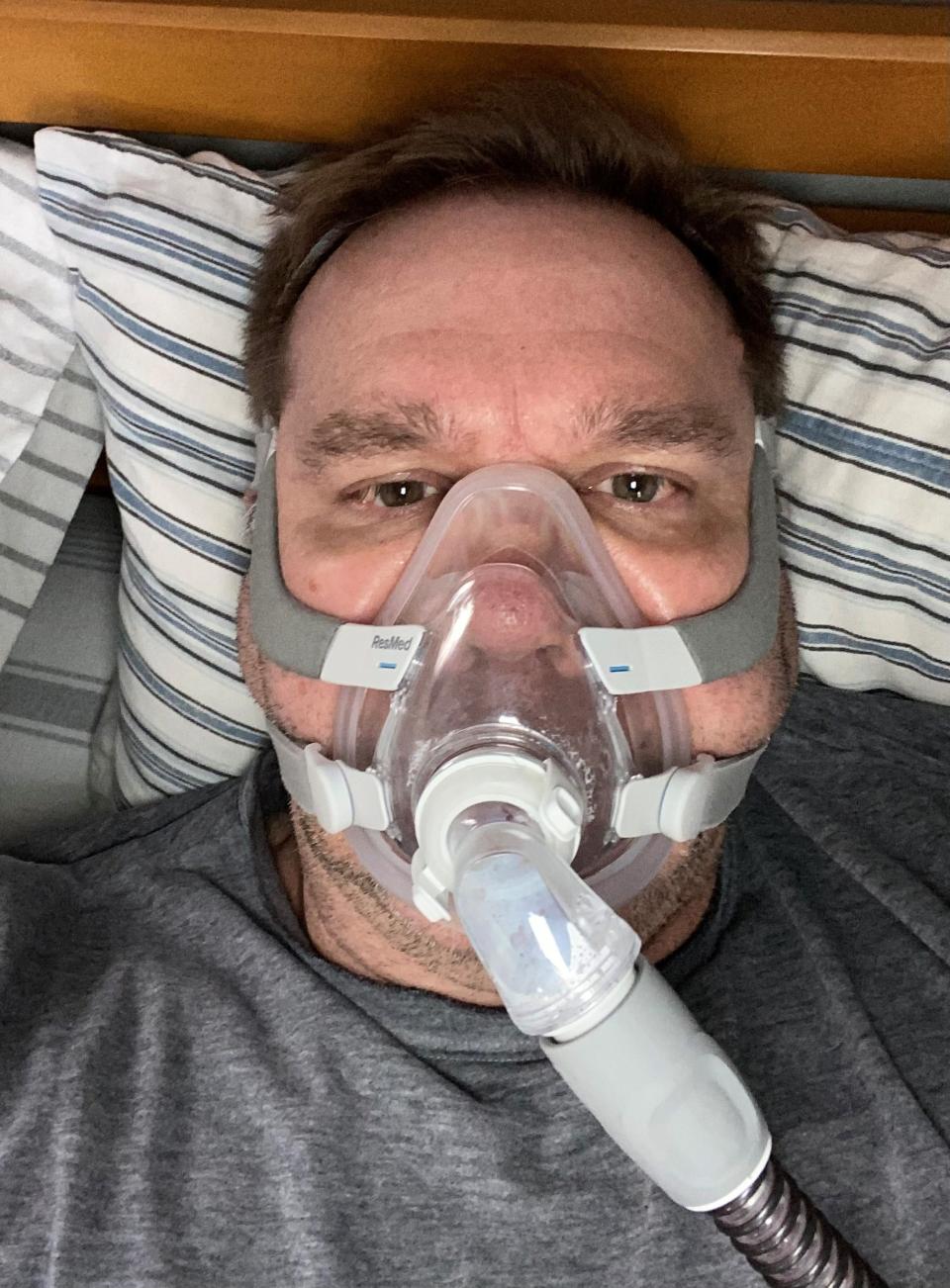 Keith Uhlig with a CPAP mask.