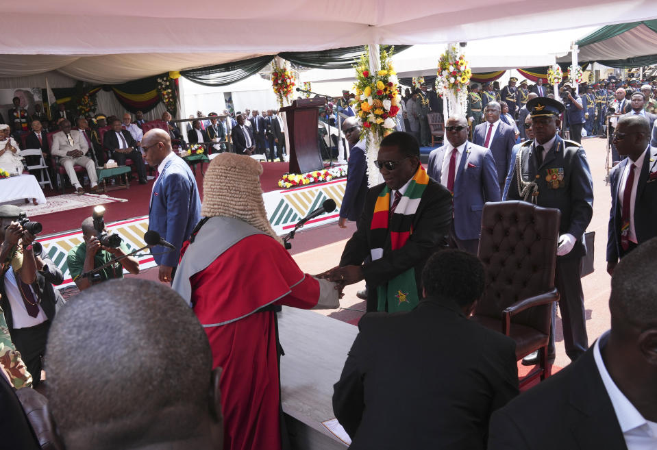 Zimbabwe's President Emmerson Mnangagwa takes his oath during his inauguration ceremony at the National Sports Stadium in the capital Harare, Monday, Sept. 4, 2023. Mnangagwa Monday hailed recent elections as a sign of the country’s “mature democracy” and a victory over Western adversaries, as he took an oath of office following polls whose credibility was questioned by multiple observer missions, including those from Africa. (AP Photo /Tsvangirayi Mukwazhi)